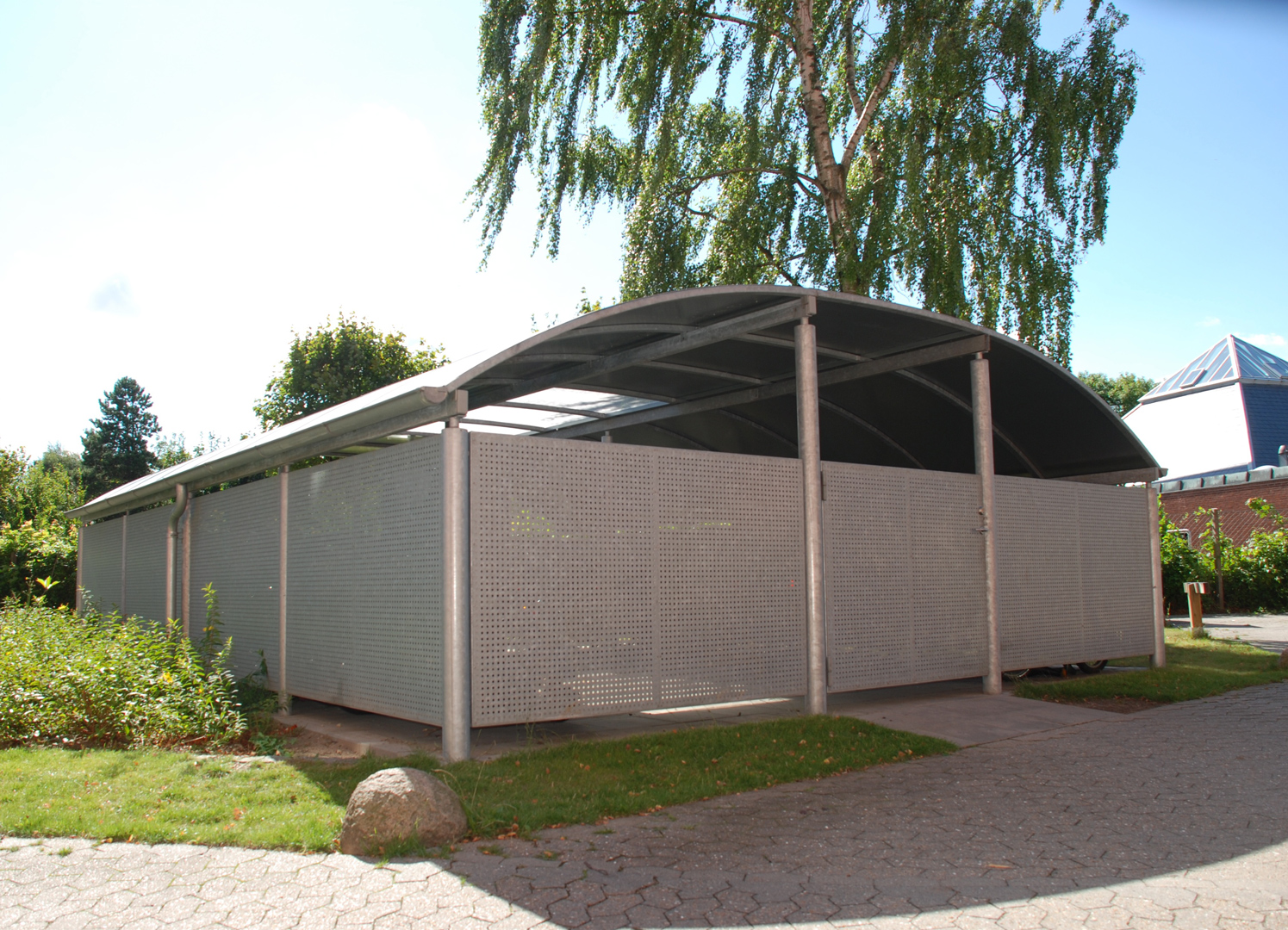 Bin shelter with a steel roof and sides