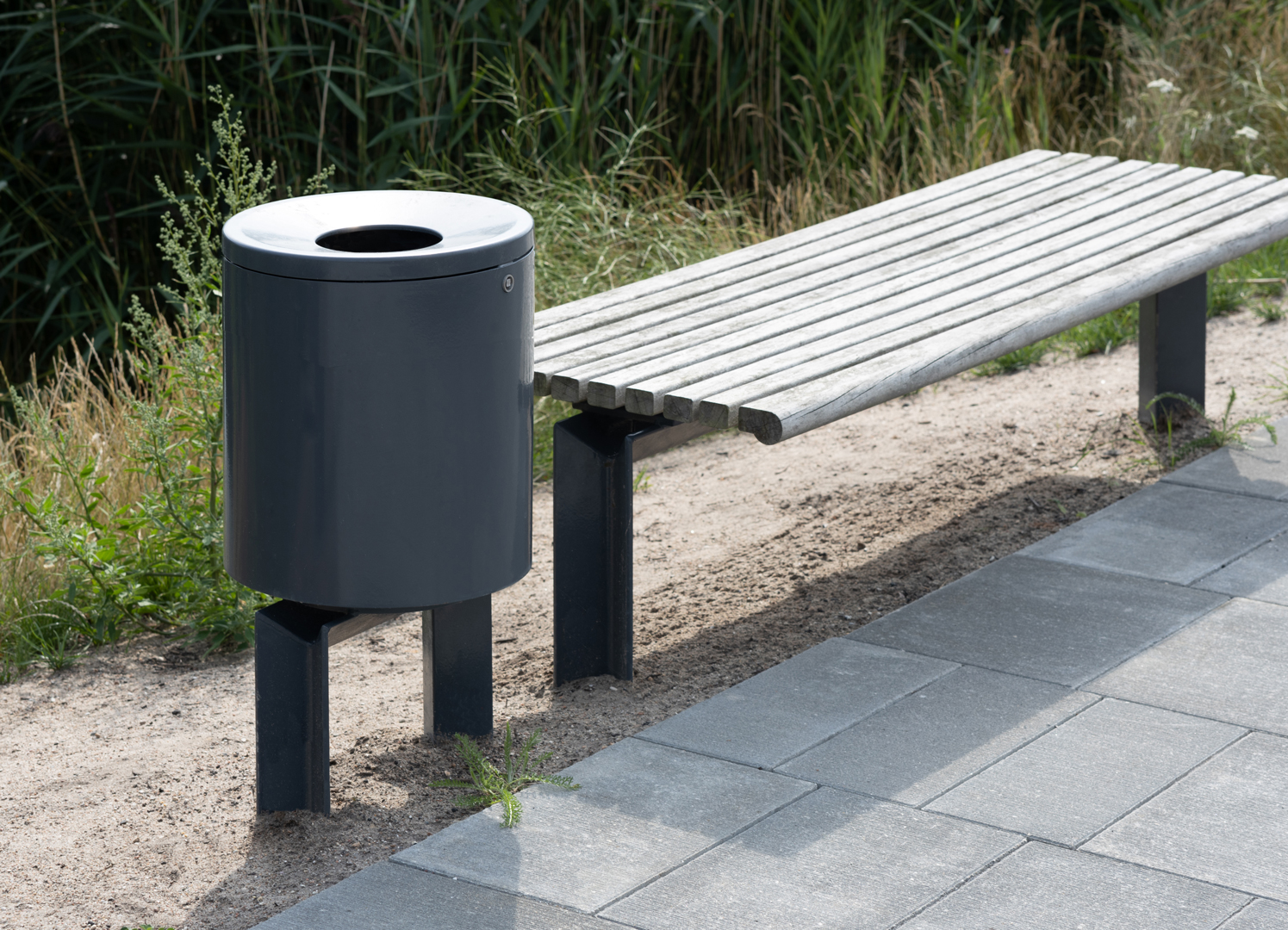 COMFORT litter bin seen next to COMFORT bench for urban spaces