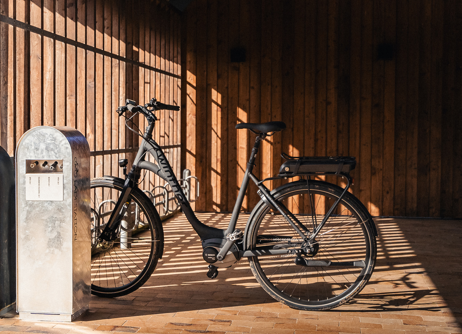 Bike racks and electric bike charging station in combination